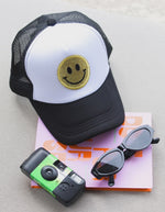 Glitter Smiley Face Trucker Hat | Gold/Black + White